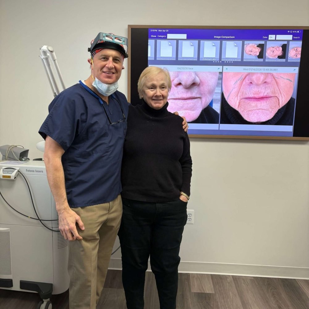 Dr. Craig Singer with a happy patient after treatment at his Bingham Farms dermatology practice