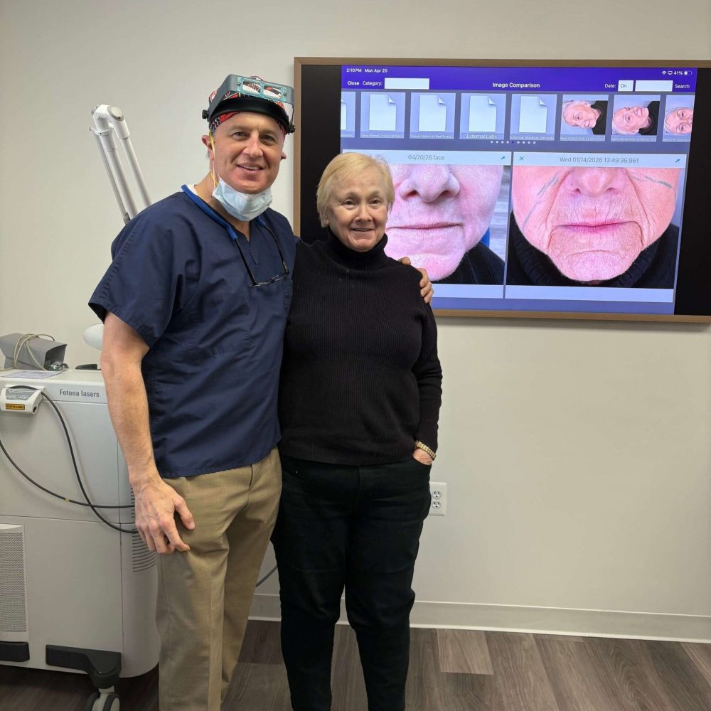Dr. Craig Singer with a happy patient after treatment at his Bingham Farms dermatology practice