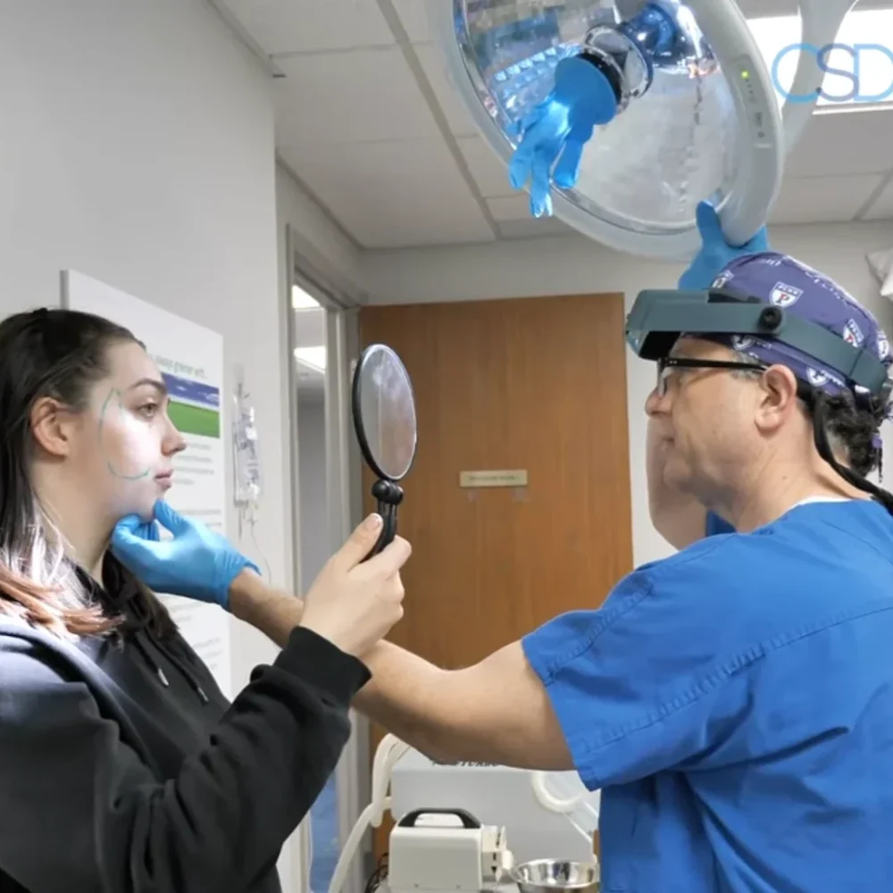 Dr Singer examines the patient before treatments